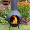 Helios Cast Iron Chiminea - front view in garden